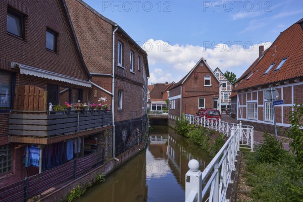 Moat Jorker Hauptwettern with brick houses in Jork, Altes Land, district of Stade, Lower Saxony, Germany, Europe