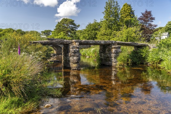 The medieval stone slab bridge Clapper Bridge in Postbridge, Dartmoor, Devon, England, Great Britain