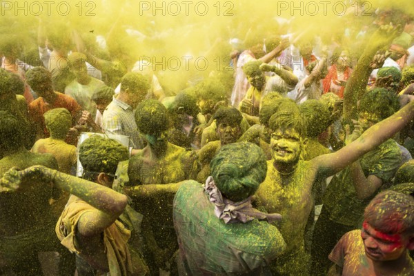 Revellers dancing in the beat of music as they celebrate Holi on a street, the Hindu spring festival of colours on March 25, 2024 in Guwahati, Assam, India. Holi, also known as the Festival of Colors or the Festival of Spring, is one of the most vibrant and joyous festivals in India