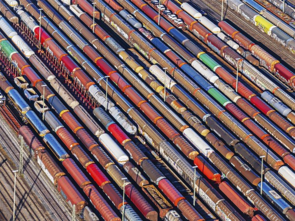 Deutsche Bahn AG marshalling yard. Many goods trains are parked on the tracks with tank wagons, car transporters and other wagons, companies transport a considerable part of their freight by rail, aerial view, Germany, Europe