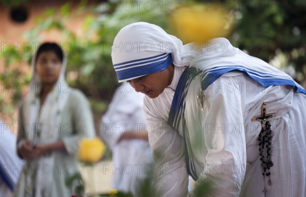Nuns offer prayers on the grave during the All souls day observation, in Guwahati, India on 2 November 2024. All Souls' Day is a Christian holiday dedicated to honoring and praying for the souls of the departed