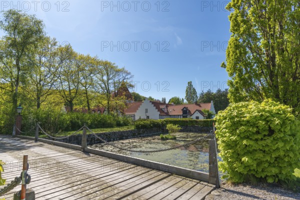 Risinge Herregaard, Ullerslev, Fyn manor house, moat, wooden bridge, trees, island of Funen, Denmark, Europe