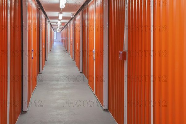 Orange interior of self storage rental units at an enclosed mini warehouse facility in Gulfport, Mississippi, USA, North America