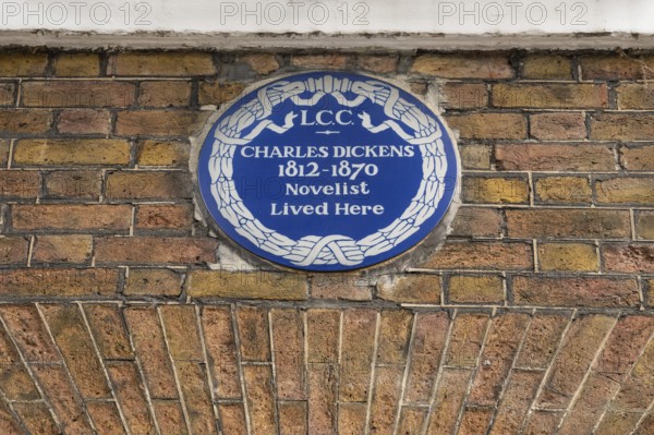Blue plaque commemorating Charles Dickens on a brick wall, Charles Dickens Museum, 48-49 Doughty Street, Holborn, London Borough of Camden, England, United Kingdom, Europe