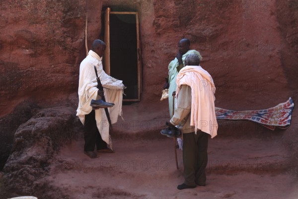 Lalibela, at the eastern group of rock-hewn churches, pilgrims at the double church of Gabriel-Raphael, Pray Gabriel-Raphael, Ethiopia, Africa
