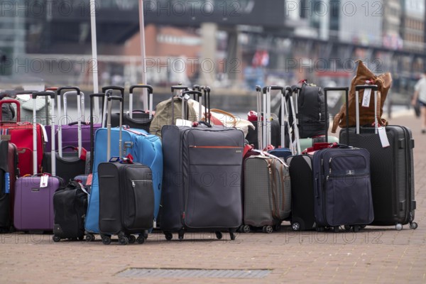 Luggage waiting to be loaded onto river cruise ships at Viking Cruise Port Amsterdam, Netherlands