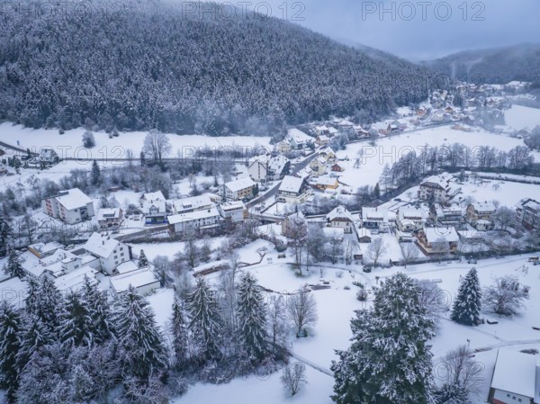 A small village in a snow-covered hilly landscape surrounded by forests, Enzklösterle, Calw district, Black Forest, Germany, Europe