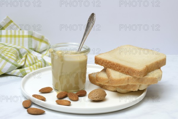 Almond cream in a jar and toast