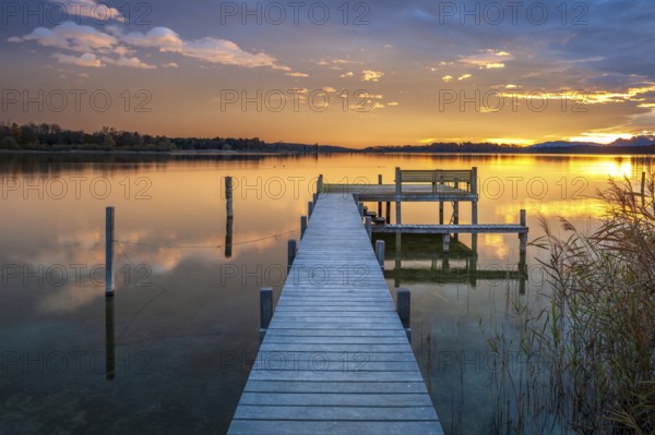 Footbridge on Lake Chiemsee at sunrise, with the Chiemgau Alps in the background, Chiemgau, Bavaria, Germany, Europe