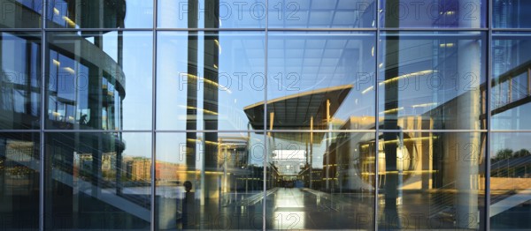 The Marie-Elisabeth-Lüders-Haus is reflected in the façade of the Paul-Löbe-Haus, functional building of the German Bundestag, government district, Berlin-Mitte, Berlin, Germany, Europe
