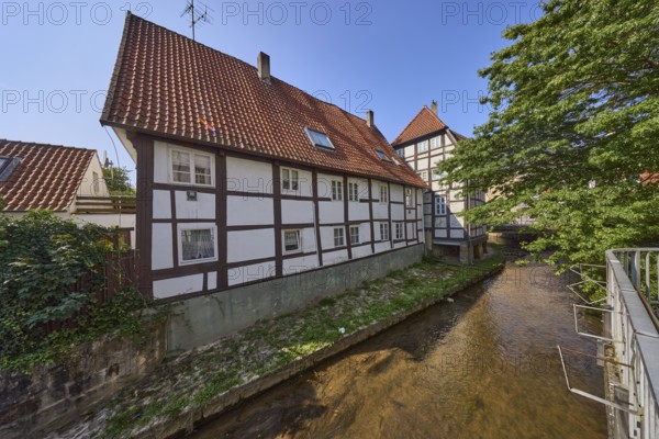 Half-timbered house against a cloudless blue sky on the Salze river in the city centre of Bad Salzuflen, Lippe district, North Rhine-Westphalia, Germany, Europe