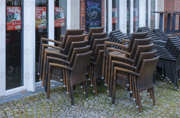 Coesfeld, North Rhine-Westphalia, Germany - Stacked pedestrian zone in times of the corona pandemic, Coesfeld district starts as a model region in North Rhine-Westphalia with relaxations, stacked chairs in front of a closed café