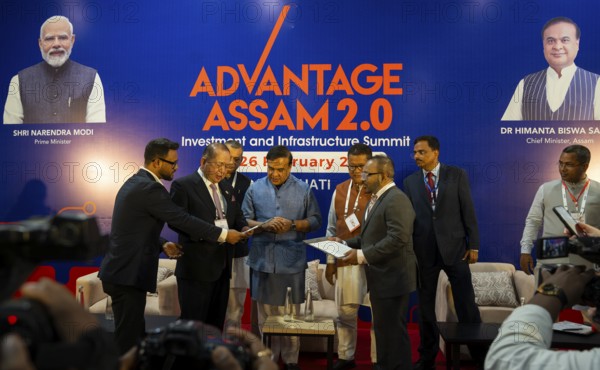 Assam Chief Minister Himanta Bishwa Sarma with investors on a MoU sign function during The Advantage Assam 2.0 Investment Summit in Guwahati, India on 25 February 2025