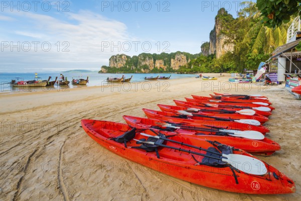 Beach landscape with kayak boats near Krabi, longtail boat, water taxi, wooden boat, weather, sky, nature, beach, beach holiday, beach holiday, active holiday, outdoor, asian, limestone rocks, sea, island, seascape, travel, tourism, seascape, climate, tropical, holiday, beach landscape, chalk cliffs, exotic, bay, bay of the sea, rock, rocky, sandstone cliffs, coast, coastal landscape, landscape, nature, natural landscape, Siam, paradise, holiday paradise, seascape, Railay beach, Phuket, Thailand, Asia