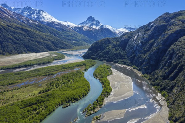 Branching arms of river Rio Ibanez, sandbanks, reflections on a sunny day, near Villa Cerro Castillo, aerial view, Mt. Cerro Castillo in the back, Patagonia, Chile, South America