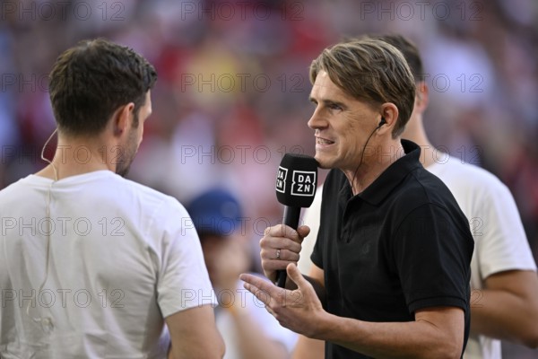 Interview with sports director Christoph Freund FC Bayern Munich FCB, microphone, mike, logo, DAZN, Allianz Arena, Munich, Bavaria, Germany, Europe