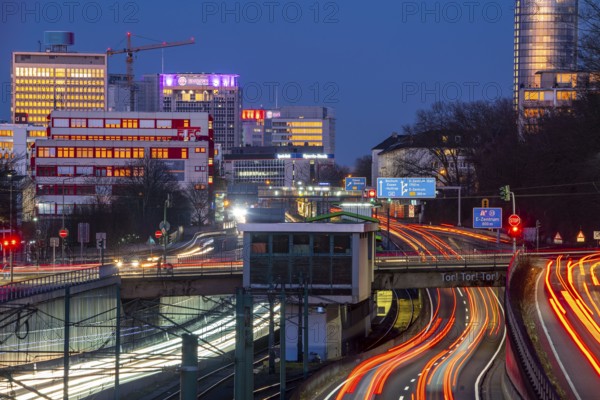 The skyline of Essen city centre, A40 motorway, Ruhr Expressway, North Rhine-Westphalia, Germany, light rail, underground, Hobeisenbrücke stop, Europe