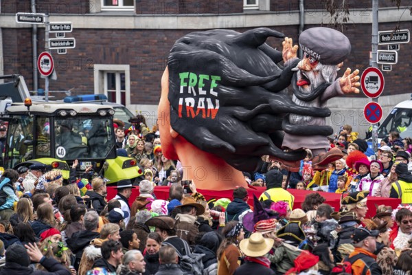Rose Monday parade in Düsseldorf, street carnival, carnival float, by float builder Jacques Tilly, the hair of woman from the freedom movement in Iran devours a religious mullah