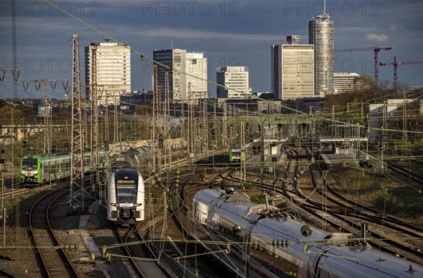 Train on the tracks west of Essen central station, city centre skyline, ICE and RRX, Rhine-Ruhr Express train, North Rhine-Westphalia, Germany, Europe