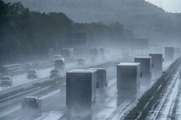 A2 motorway, at Recklinghausen motorway junction, heavy traffic during a thunderstorm, North Rhine-Westphalia, Germany, Europe