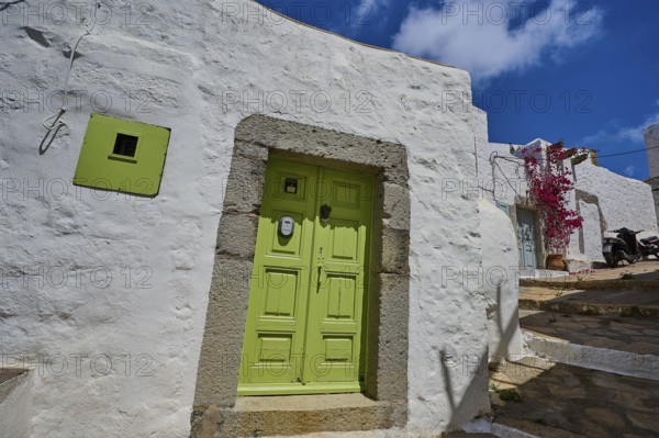 White house with light green door, blue sky, Mediterranean style, sunny day, Chora, main town Patmos, Patmos, old town, Dodecanese, Greek Islands, Greece, Europe