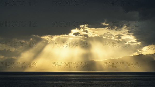 Sun rays in the clouds over Sicily, Tyrrhenian Sea, Italy, Europe