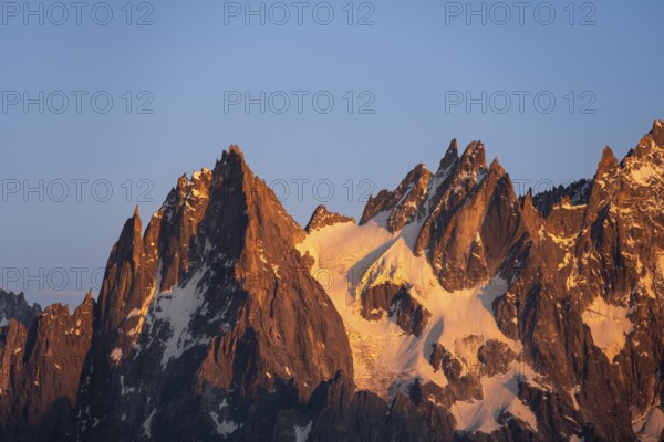 Rocky pointed mountain peaks at sunset, alpenglow, Aiguille du Plan, Mont Blanc massif, Chamonix, France, Europe