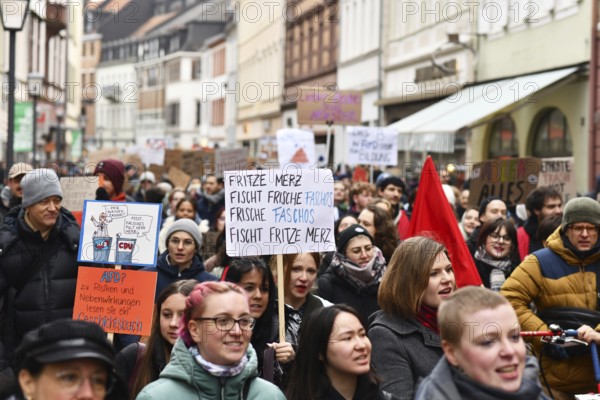 Heidelberg, Germany - February 12th 2025: Crowd of people with signs at protest against far-right