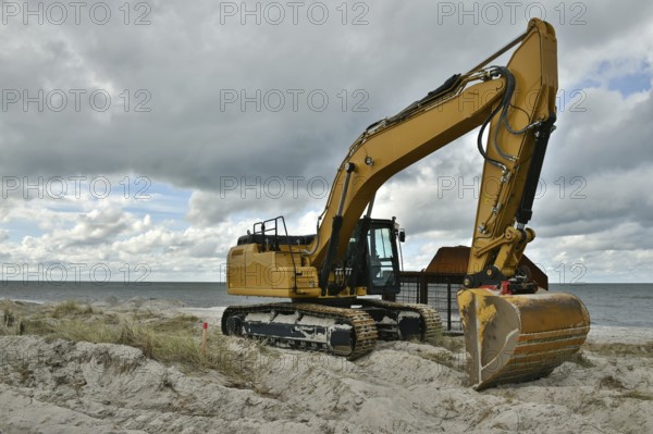 Excavators working to reclaim land on the beach of the Darß peninsula, Mecklenburg-Western Pomerania, Germany, Europe