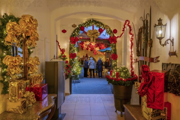 Christmas decorated passage to the mulled wine stand in the side passage at the Christmas market, Bad Tölz, Isartal, Upper Bavaria, Bavaria, Germany, Europe