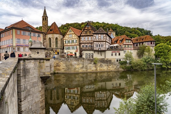 Half-timbered houses on the Kocher and St John's Church in Heimbach, Schwäbisch Hall, Baden-Württemberg, Germany, Europe