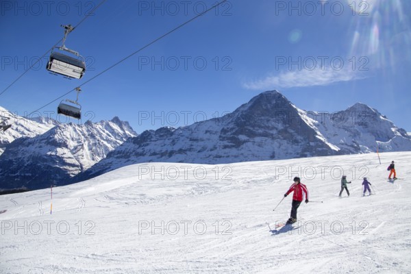 25 March 2024: Skiing against the backdrop of the north face of the Eiger in Grindelwald, Switzerland, Europe