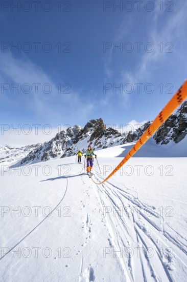 Ski tourer with rope, rope team on the Vadret da Porchabella glacier on the ascent to the summit of Piz Kesch, mountain landscape in winter, alpine tour, ski tour Bündner Haute Route, Albula Alps, Rhaetian Alps, Grisons, Eastern Switzerland, Switzerland, Europe