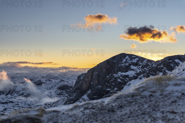 Snow-covered mountains at sunrise with dramatic clouds, Upper Austria, Austria, Europe