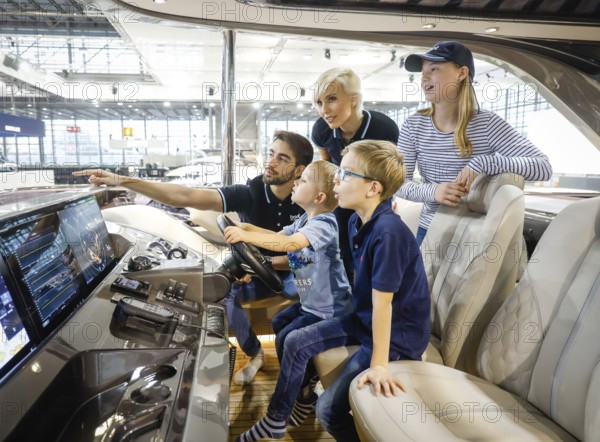 Messe boot Düsseldorf, Model family posing on the English Princess Yacht Rose Y85 on the occasion of a press event, Düsseldorf, North Rhine-Westphalia, Germany, Europe
