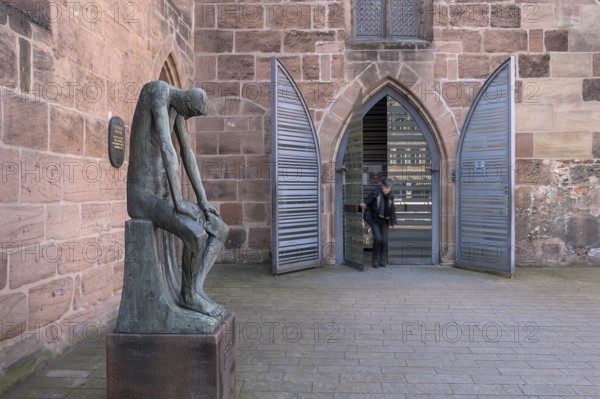 Main entrance of St Clare's Church, on the left the bronze sculpture of Job, created by the German sculptor Gerhard Marcks in 1957, St Clare's Church, Königstraße 66, Nuremberg, Middle Franconia, Bavaria, Germany, Europe