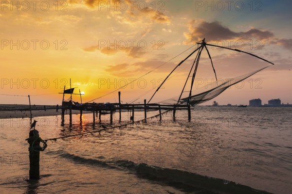 Kochi chinese fishnets on sunset in Fort Kochin, Kochi, Kerala, India, Asia