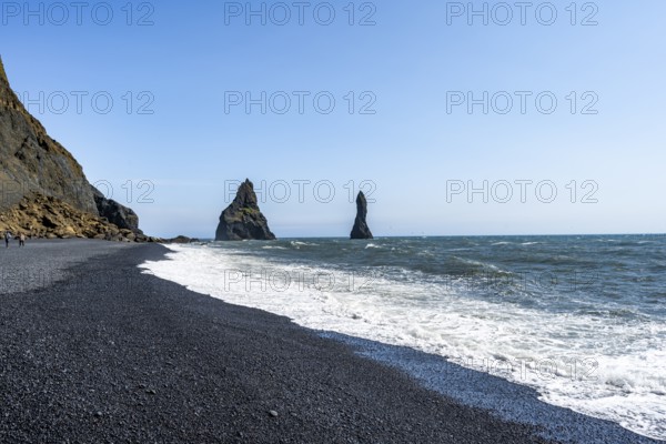 Black beach with cliffs, rock Reynisdrangar in the water, at Reynisfjara beach, Vik, South Iceland, Iceland, Europe