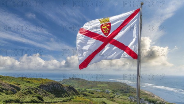 The flag of the Isle of Jersey, Great Britain flutters in the wind