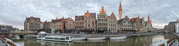 Panoramic view of historic buildings along a canal in the evening, Ghent
