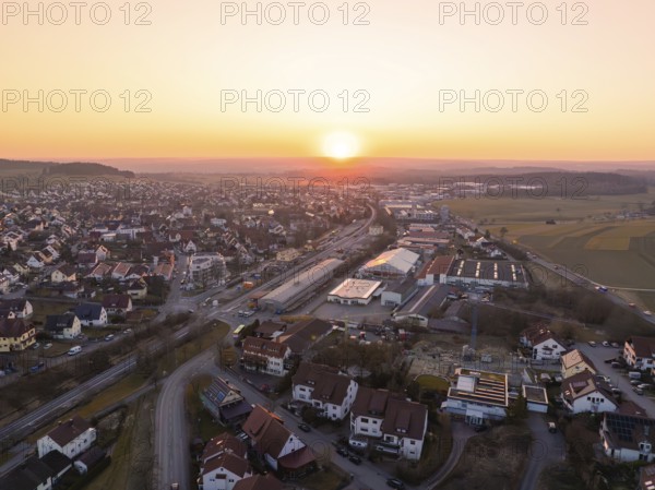 Sunset over a small town with crossroads and industrial buildings, Althengstett, Calw district, Germany, Europe