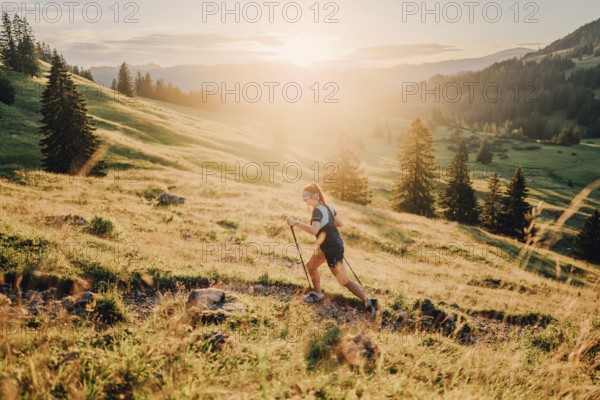 Summer trail running and hiking in the Alps on the Riedberg Pass between Obermaiselstein and Balderschwang in the Allgäu, Bavaria, Germany, Europe