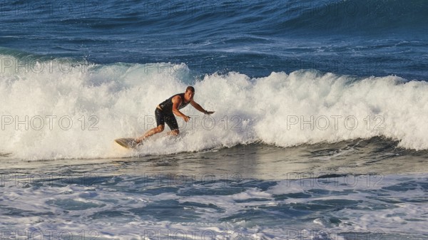 Surfer moving on a foamy wave, wave surfer, surfer, surf, waves, west coast, Arkasa, Karpathos, Dodecanese, Greek Islands, Greece, Europe