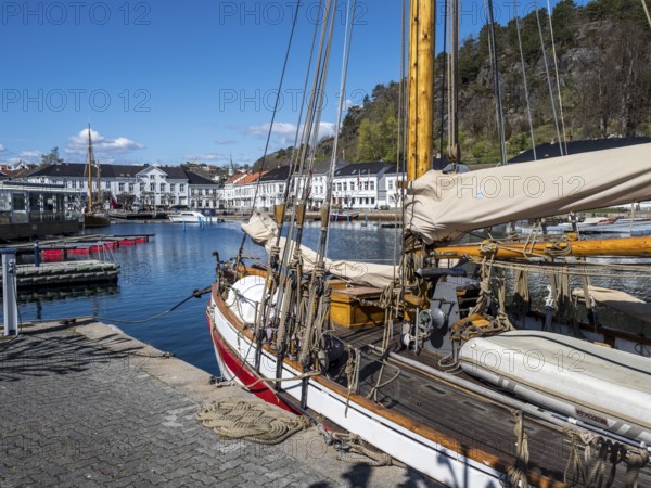 At the seaside in Risor, a traditional village with wooden white houses at the southern norwegian coast, Norway, Europe