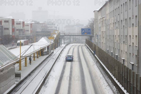 Essen, North Rhine-Westphalia, Germany - Onset of winter in the Ruhr area, few cars drive on the A40 motorway in ice and snow