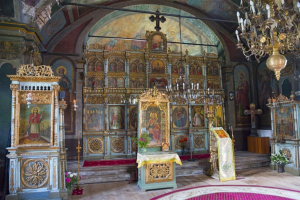 Interior view of a church with richly decorated iconostasis and religious ornaments, Suzana Orthodox Nunnery, Maneciu, Maneciu, Prahova, Muntenia, Romania, Europe