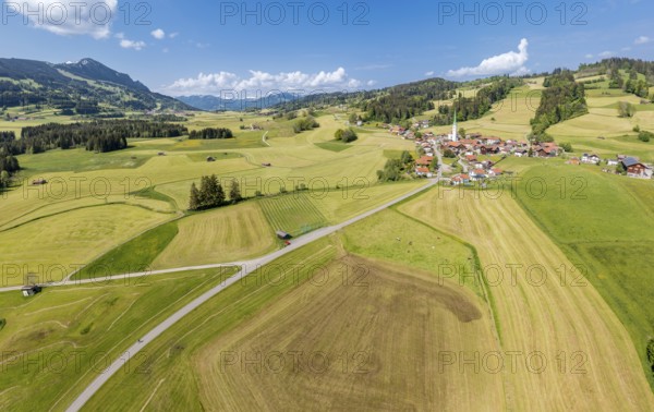 Aerial view over fields and meadows to village Vorderburg, agricultural area in spring, Allgäu, Bavaria, Germany, Europe