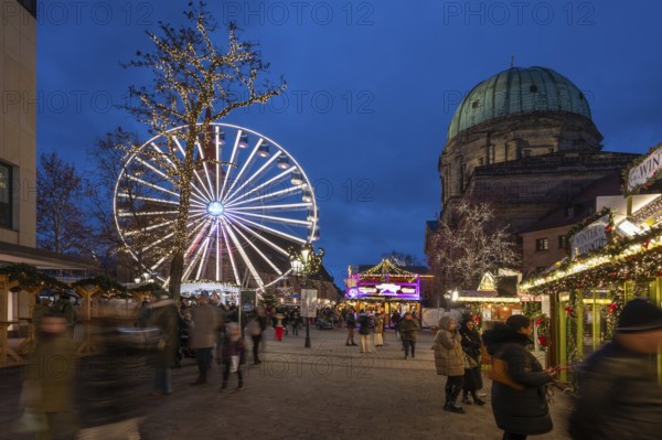 Ferris wheel at the winter village, Christmas market at dusk, St Elisabeth's Church on the right, Jakobsplatz, Nuremberg, Middle Franconia, Bavaria, Germany, Europe