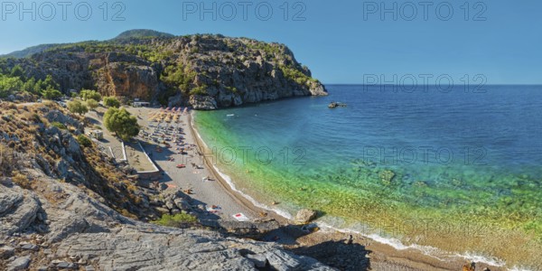 Panoramic view of Ahata Beach with clear, turquoise-coloured sea and steep cliffs, Ahata Beach, Aperi, Karpathos, Greece, Europe