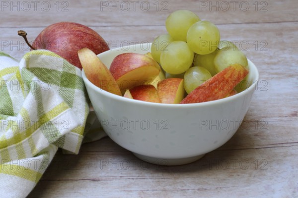Apple slices and grapes in skin